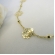Colar Longo com Bolinha e Flor Banhado em Ouro 18k