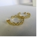 Brinco Argola Média com Vazados Ovais Banhado em Ouro 18k